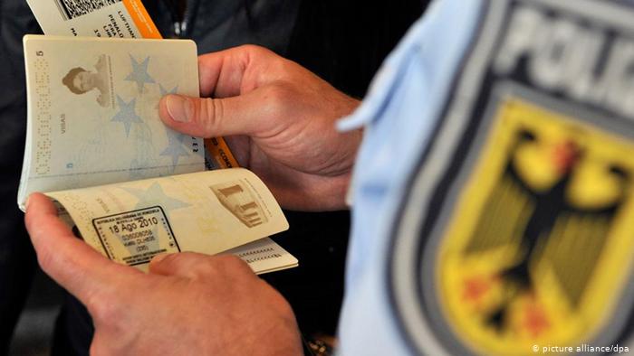 policeman checking documents